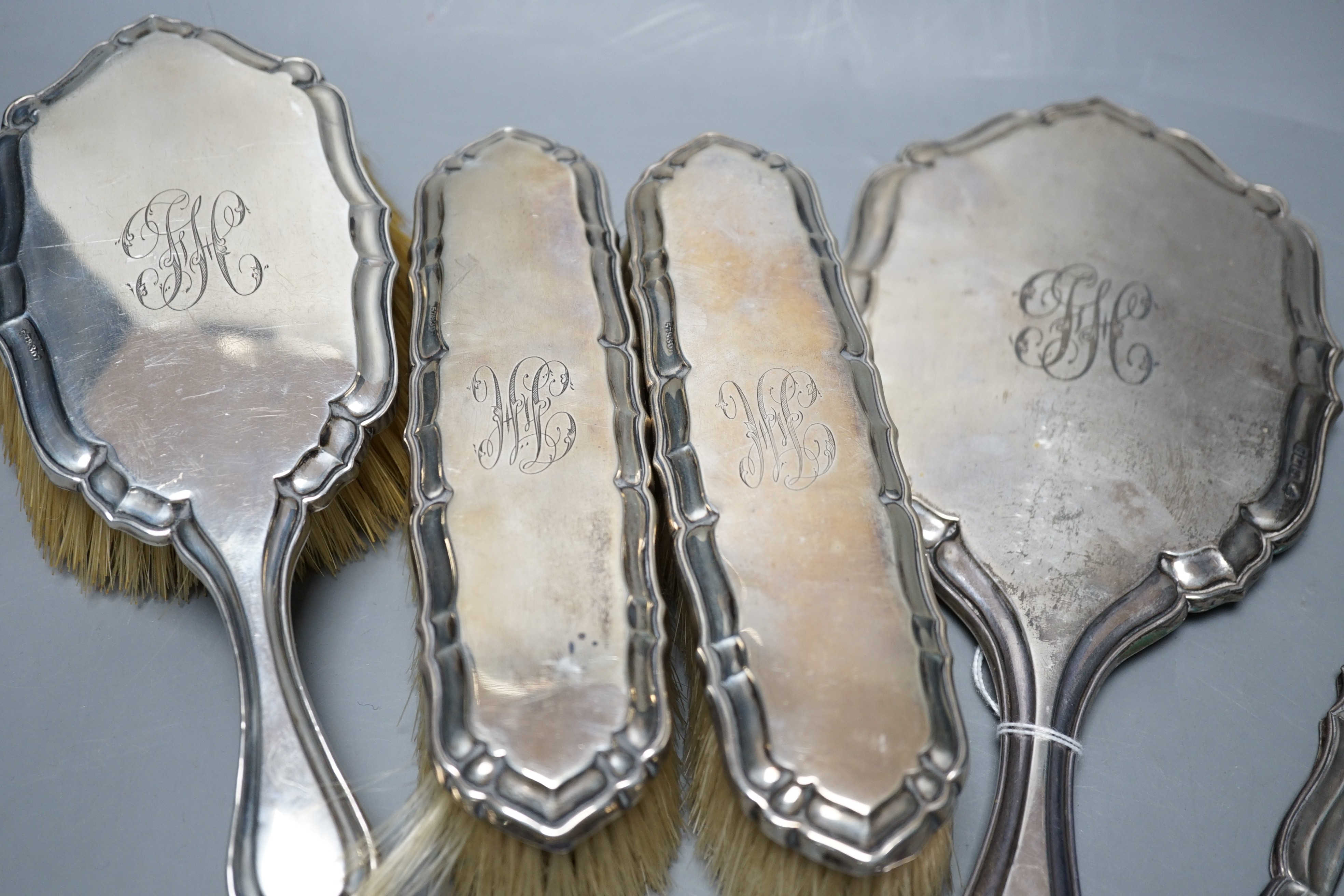 A George V silver five piece dressing table set, by Charles & Richard Comyns, London, 1917, (comb teeth missing).